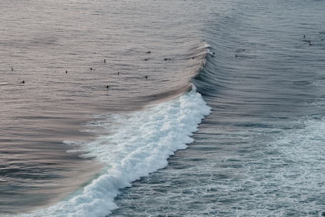 Peaceful wave break surf drone shot