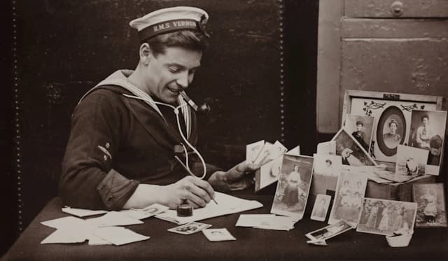 Happy sailor writing letter