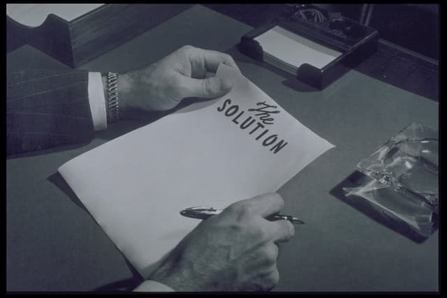 Vintage paper reading "the solution"