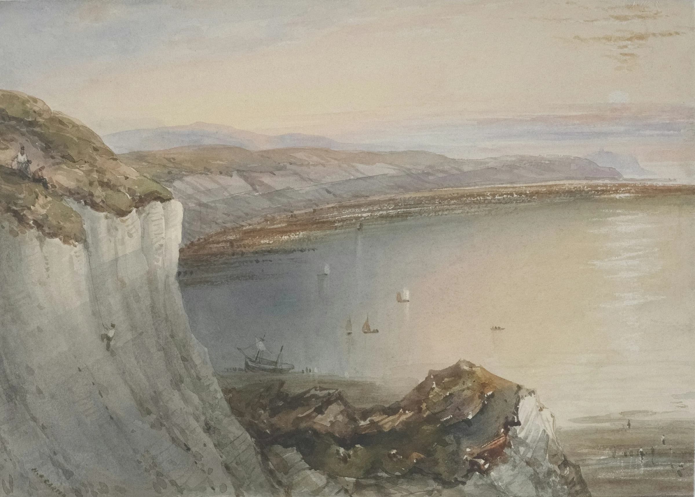 Person climbing down cliff with town and ocean in background